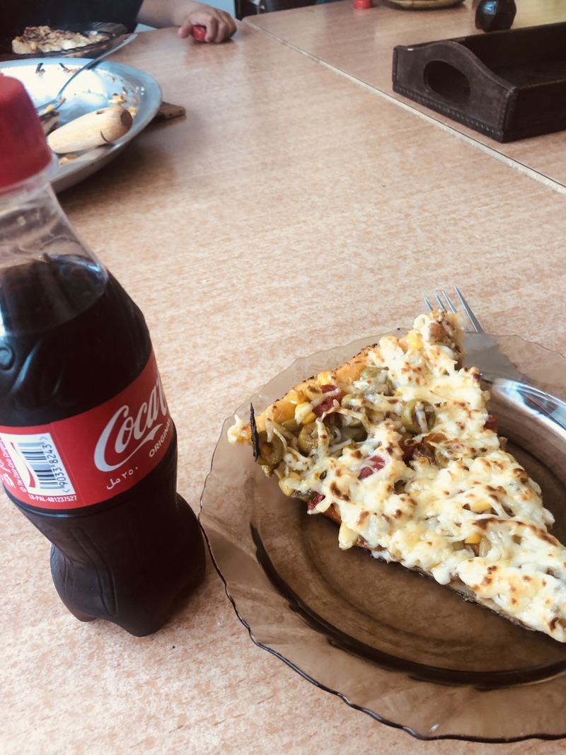 Hera segir að þetta sé besta pizza og besta kók sem hún hefur fengið.